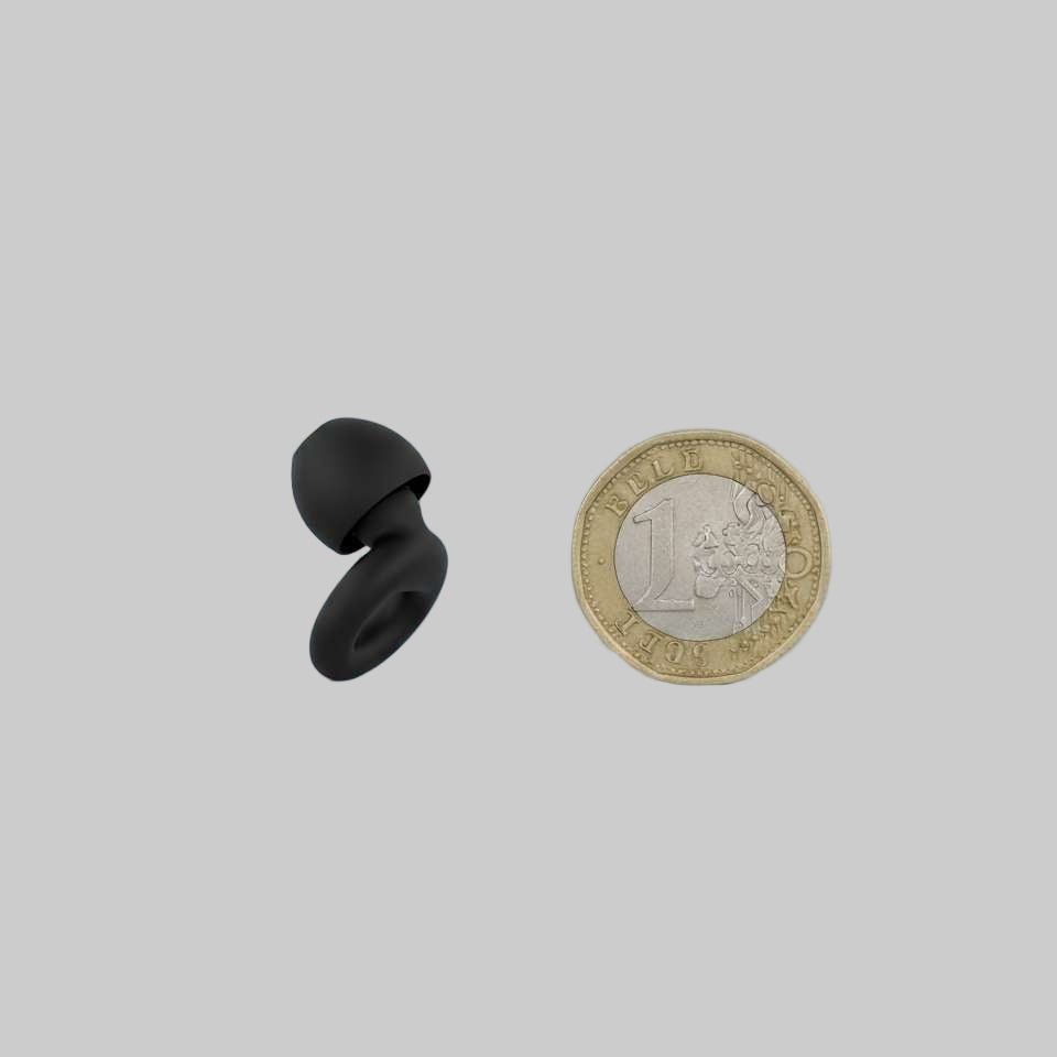 hello calm precision plugs product image showing the size reference against a pound coin