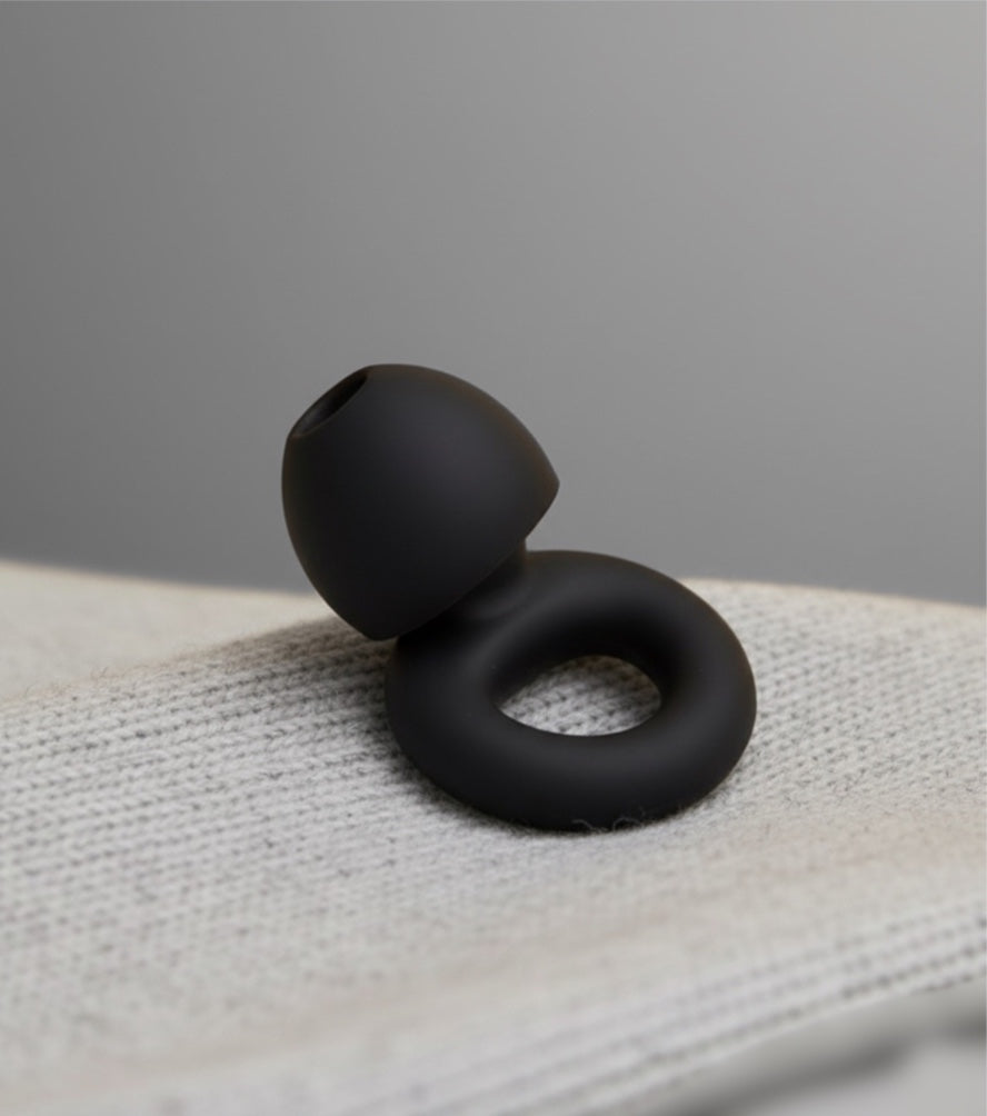 A pair of hello calm high-fidelity earplugs in a soft case, showcasing their stylish and discreet design.
